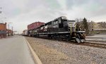 NS 6428 leads the local out of town on its way south.